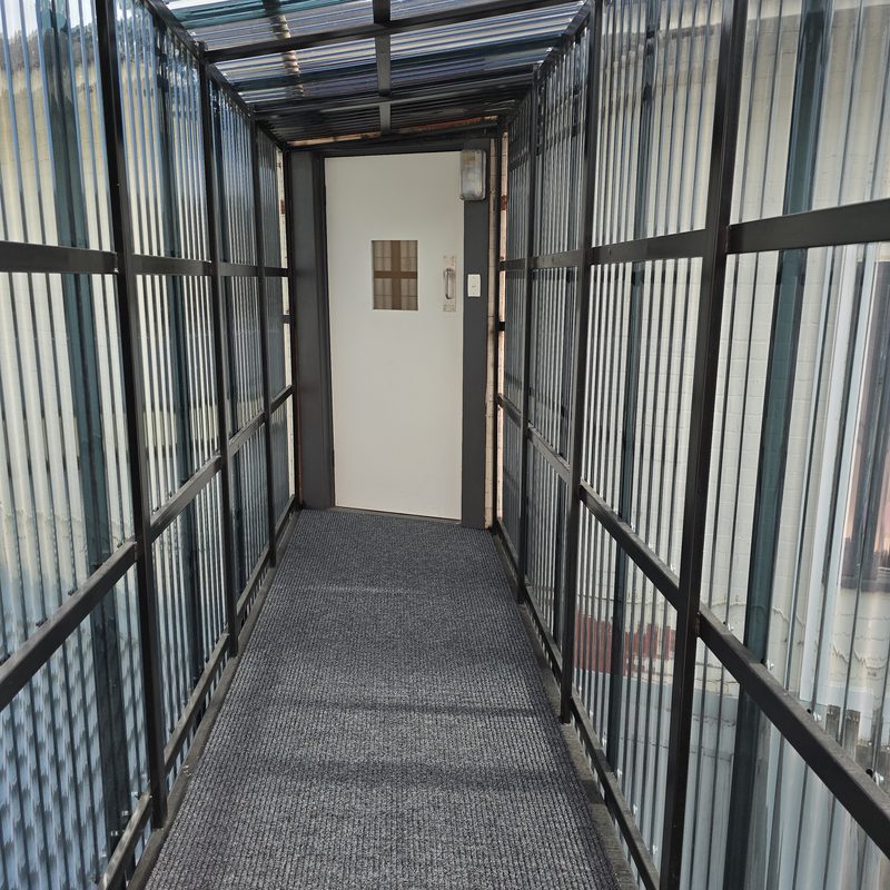 Enclosed Walkway to the Units at The Top Pub Rosebery