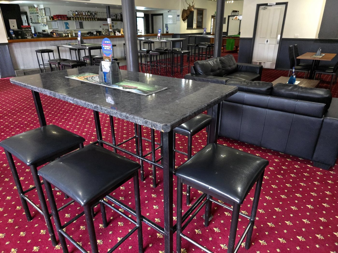 High tables in the public bar at The Top Pub Rosebery